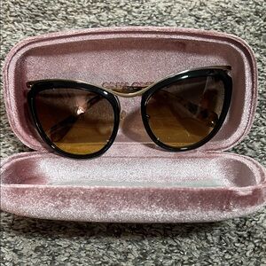 Miu Miu Black Frame Sunglasses with Brown Gradient Lenses